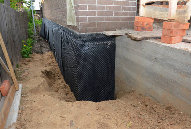 Happy homeowners after waterproofing job in Bellwood